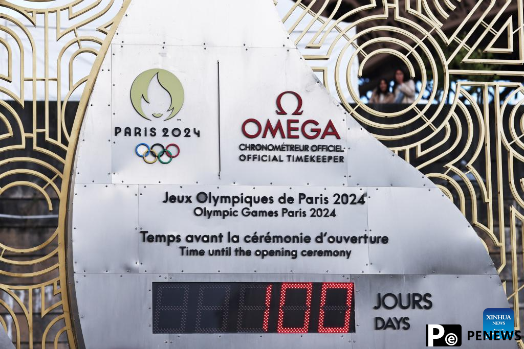 Countdown clock for Paris 2024 Olympic Games seen in front of Eiffel Tower