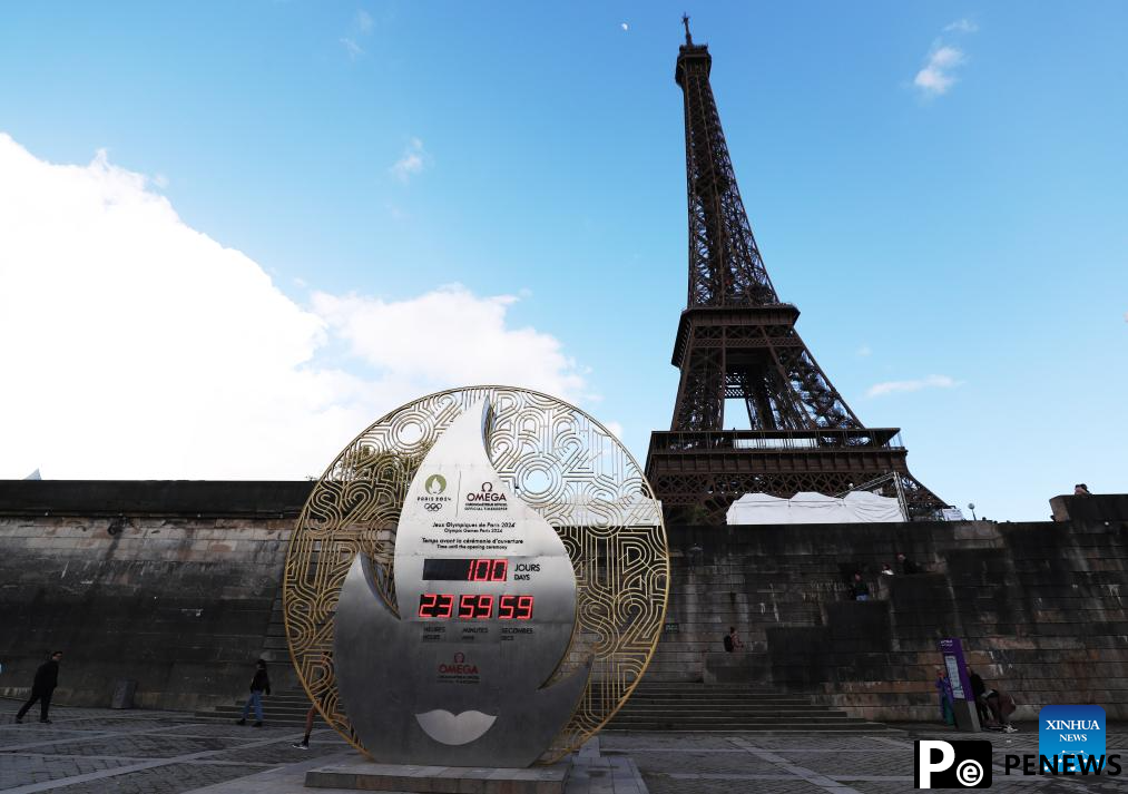 Countdown clock for Paris 2024 Olympic Games seen in front of Eiffel Tower