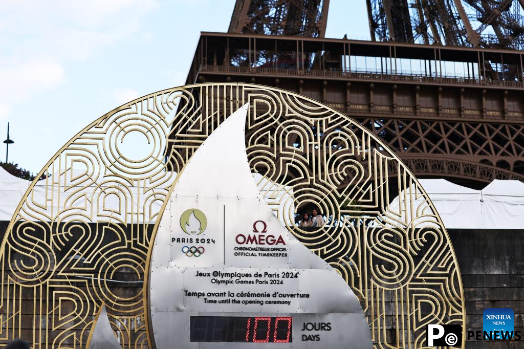 Countdown clock for Paris 2024 Olympic Games seen in front of Eiffel Tower