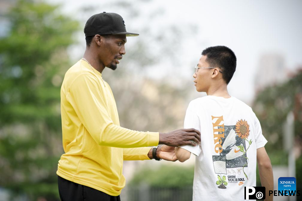 Athletes participate in pre-event school visit activity in Xiamen, China