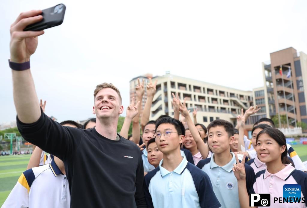 Athletes participate in pre-event school visit activity in Xiamen, China