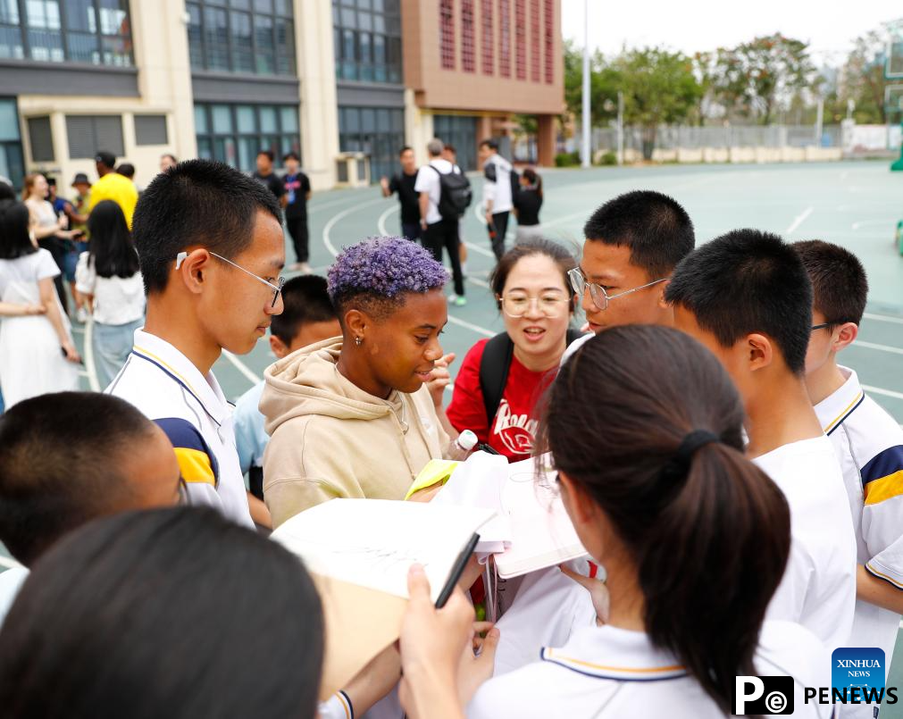 Athletes participate in pre-event school visit activity in Xiamen, China
