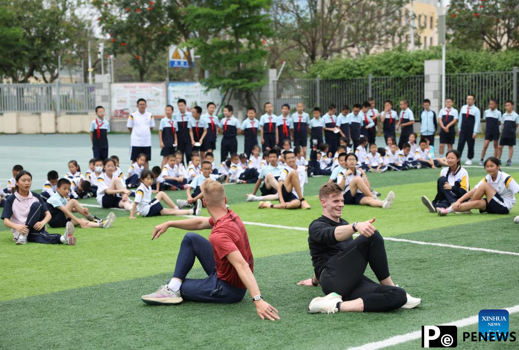 Athletes participate in pre-event school visit activity in Xiamen, China