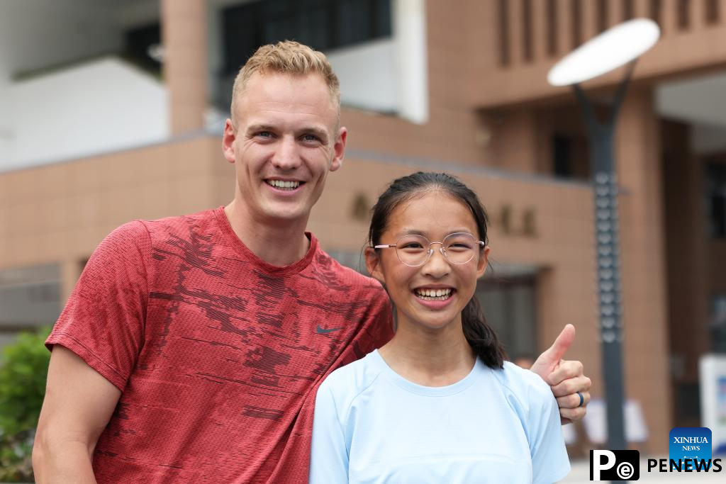 Athletes participate in pre-event school visit activity in Xiamen, China