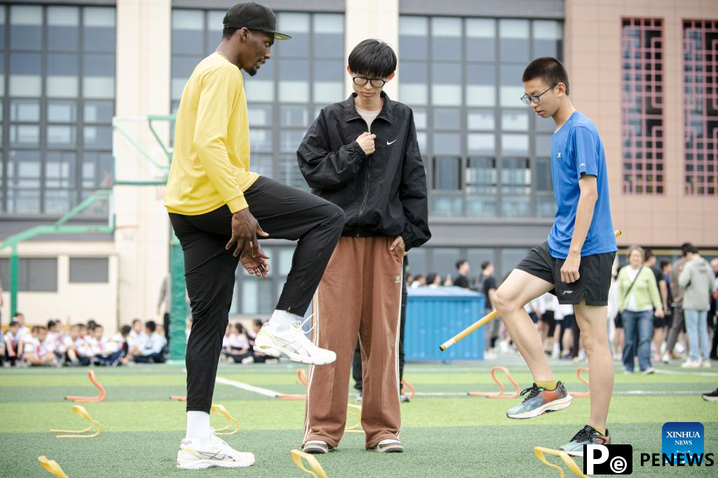 Athletes participate in pre-event school visit activity in Xiamen, China