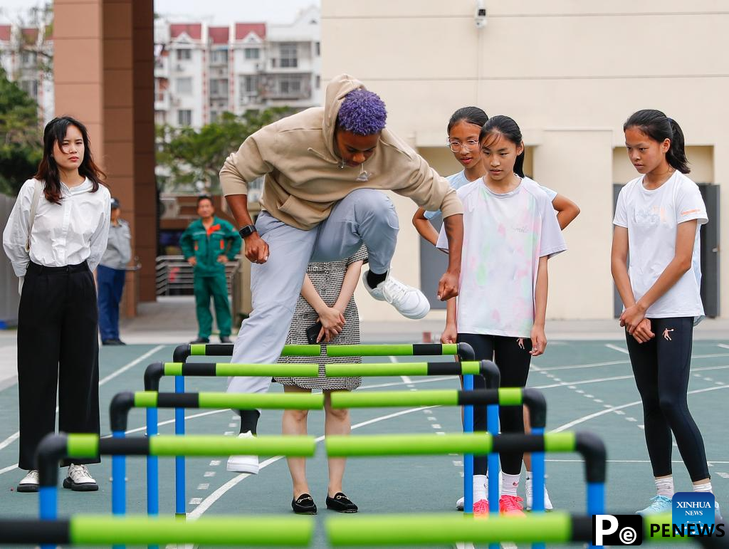 Athletes participate in pre-event school visit activity in Xiamen, China