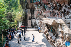Tourists visit Dazu Rock Carvings in Chongqing