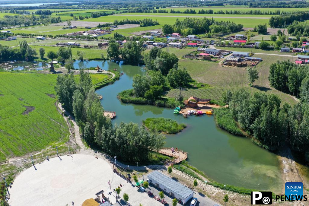 Xinjiang enters peak tourism season with various rural tour routes, cultural events