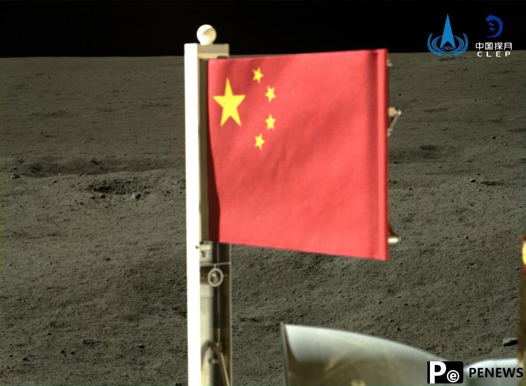 Feature: Unfurling a flag made of "stone" on the moon