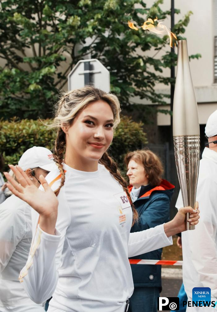 Winter Olympic champion Gu Ailing participates in Paris 2024 torch relay