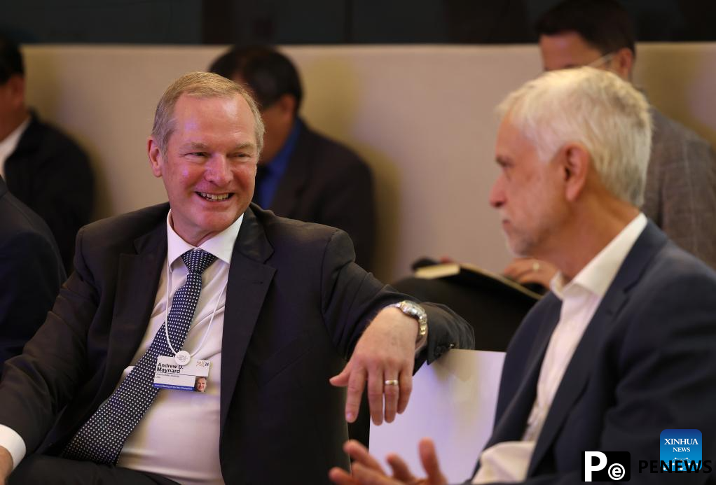 Participants interact during Summer Davos