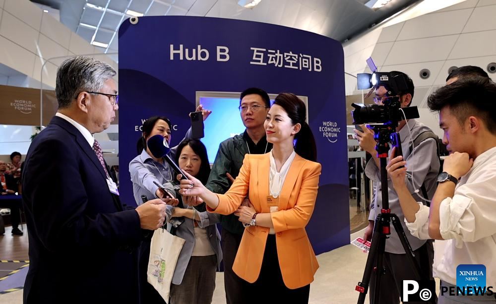 Participants interact during Summer Davos