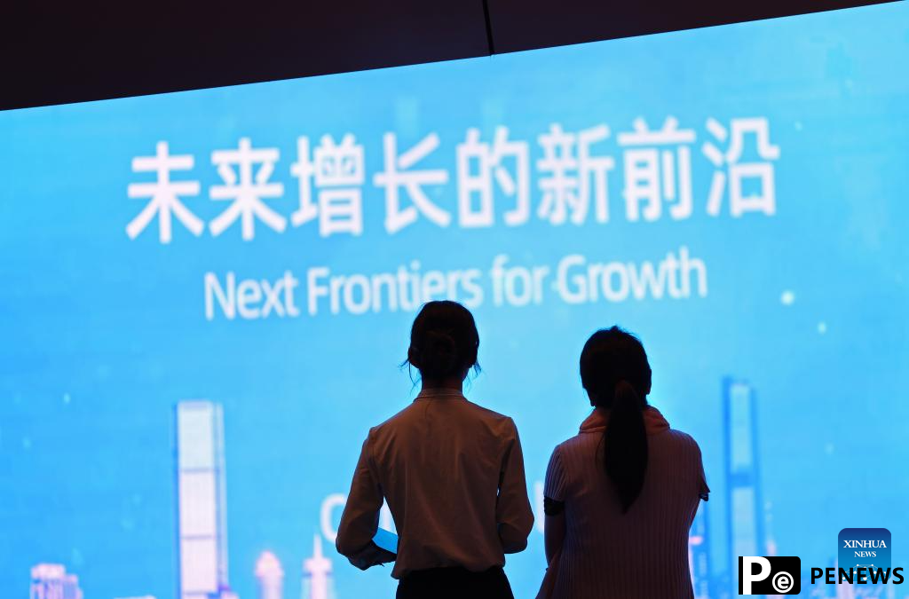 Participants interact during Summer Davos