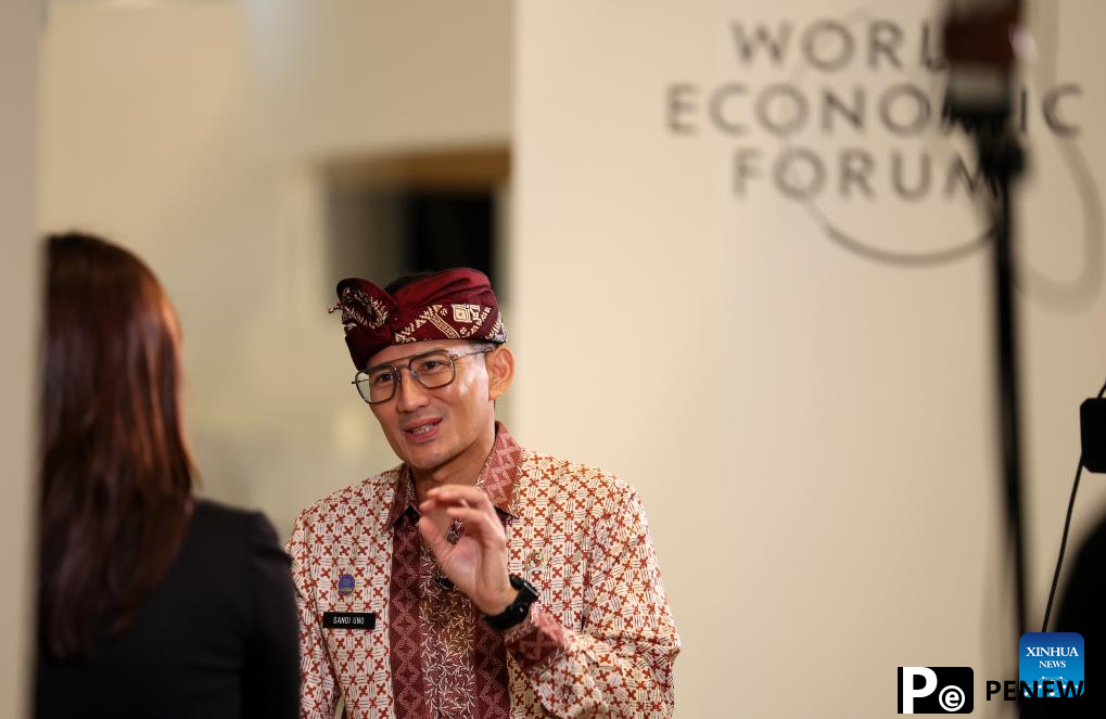 Participants interact during Summer Davos