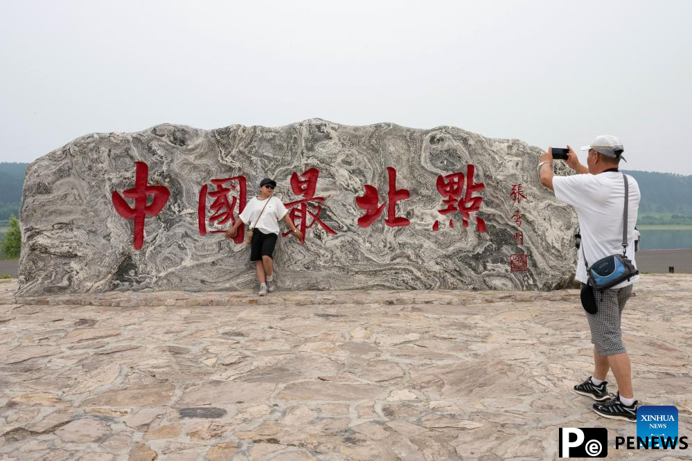 Tourists enjoy leisure time in Mohe, NE China