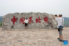 Tourists enjoy leisure time in Mohe, NE China