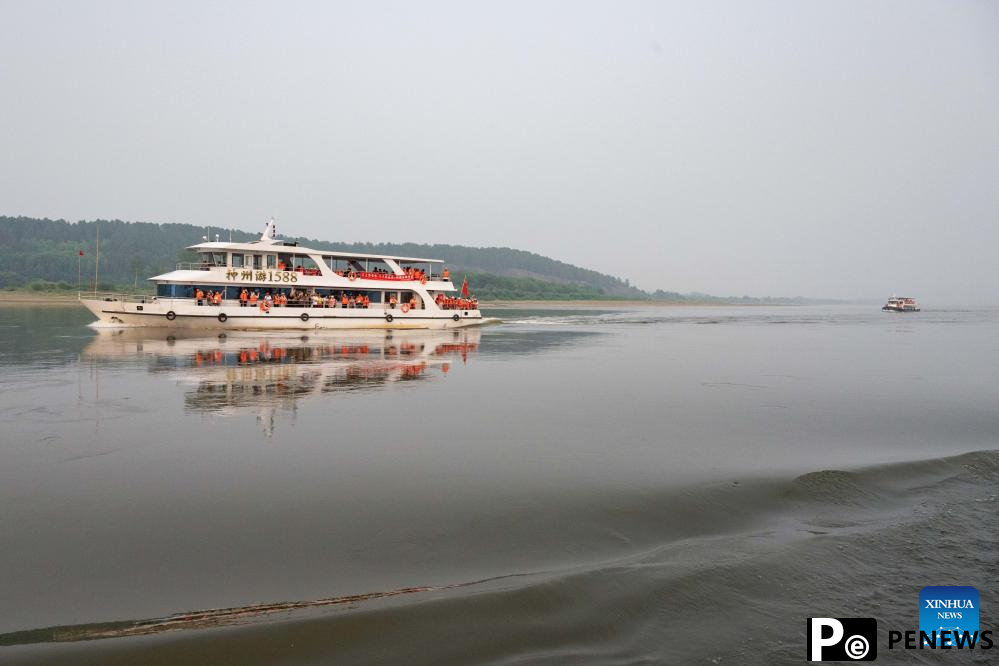 Tourists enjoy leisure time in Mohe, NE China