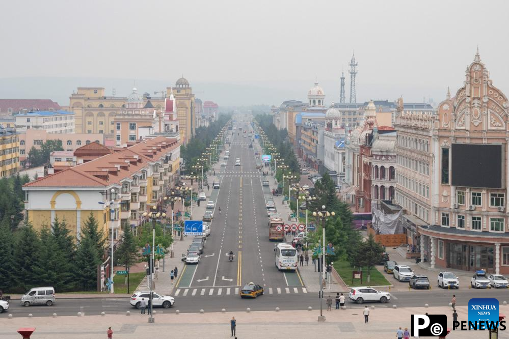 Tourists enjoy leisure time in Mohe, NE China