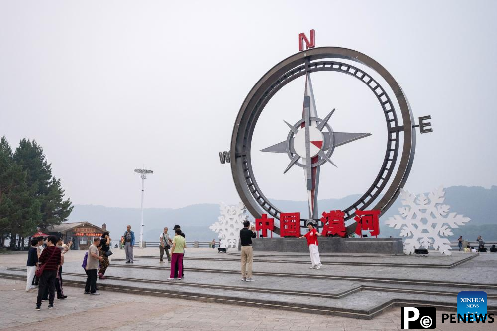 Tourists enjoy leisure time in Mohe, NE China