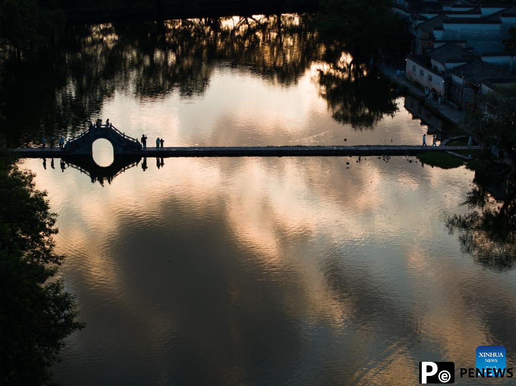 Sunset view of Hongcun Village in Yixian County, E China