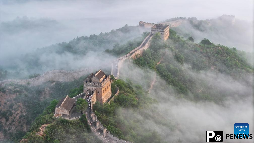 Scenery of Jinshanling section of Great Wall shrouded in clouds in Hebei