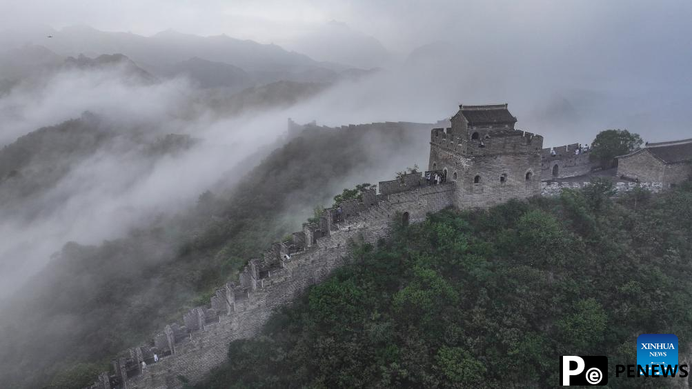 Scenery of Jinshanling section of Great Wall shrouded in clouds in Hebei
