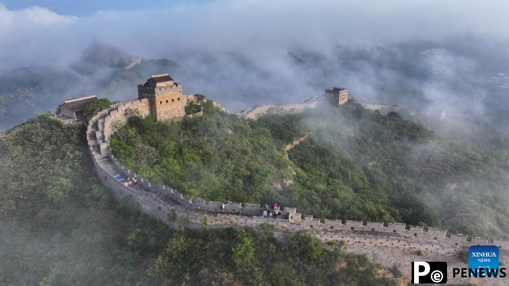 Scenery of Jinshanling section of Great Wall shrouded in clouds in Hebei