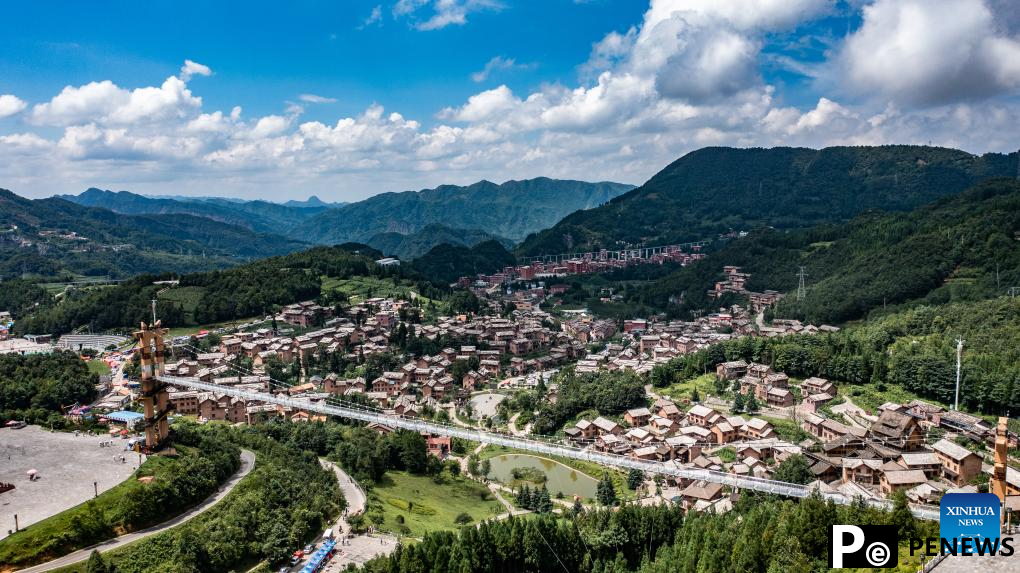 Haiping Yi ethnic cultural township sees summer tourism surge