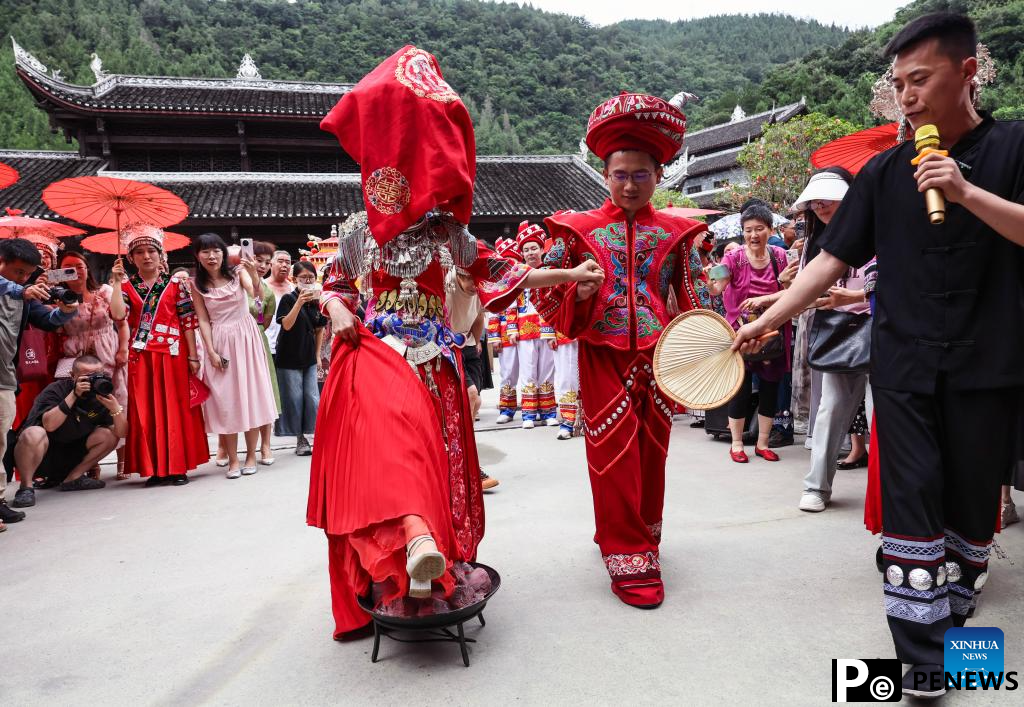 Local authorities in SW China leverage ethnic features to boost summer tourism