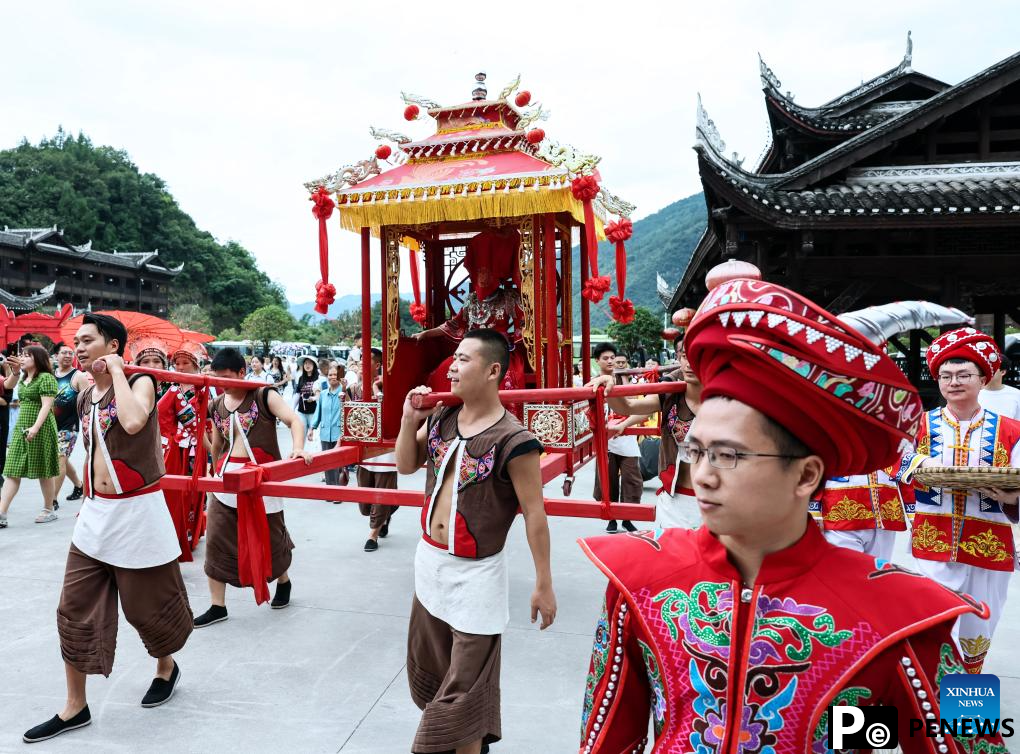 Local authorities in SW China leverage ethnic features to boost summer tourism