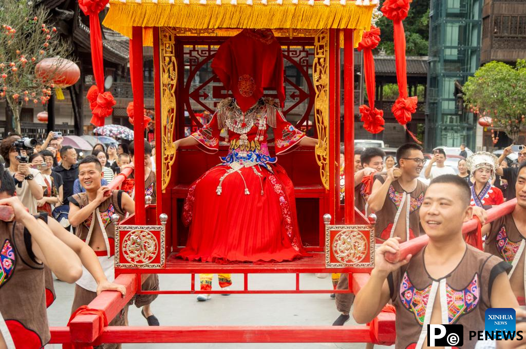 Local authorities in SW China leverage ethnic features to boost summer tourism
