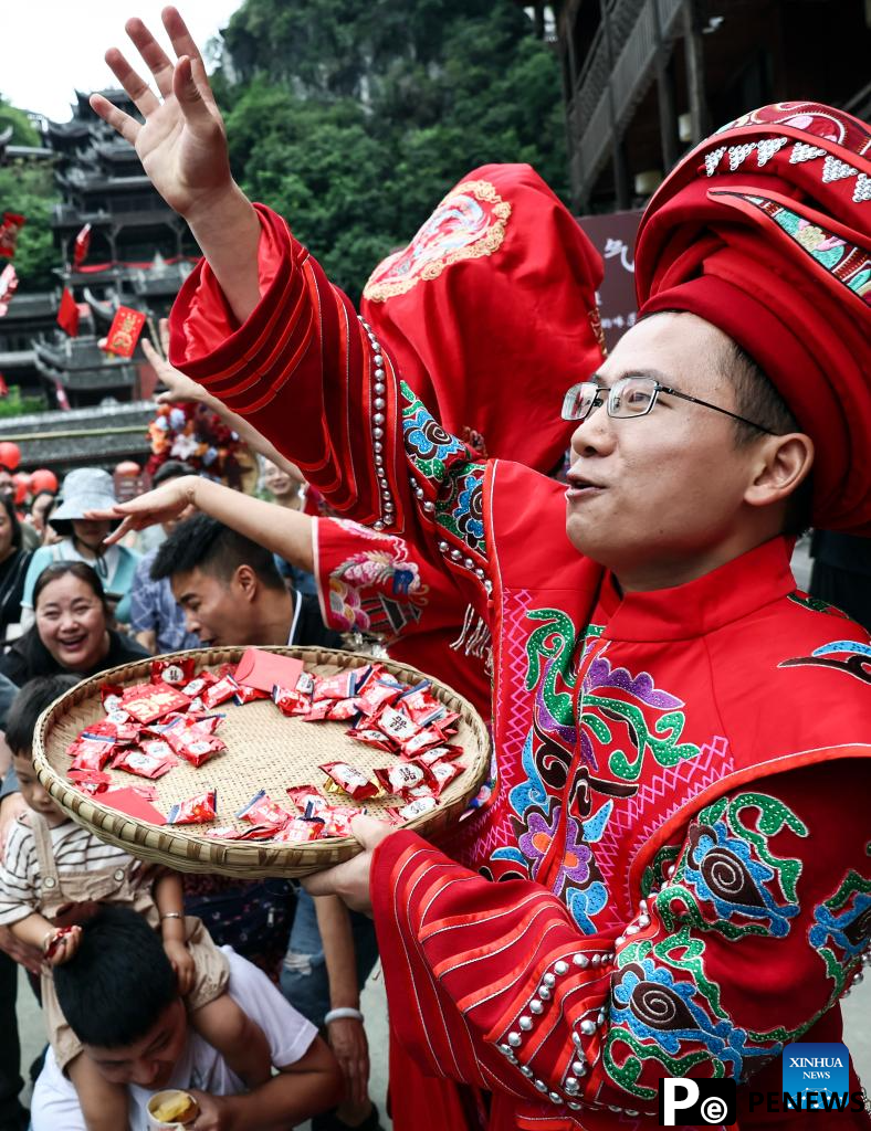 Local authorities in SW China leverage ethnic features to boost summer tourism