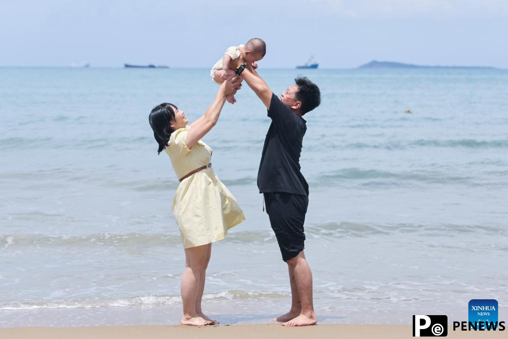 Tourists enjoy themselves in Sanya