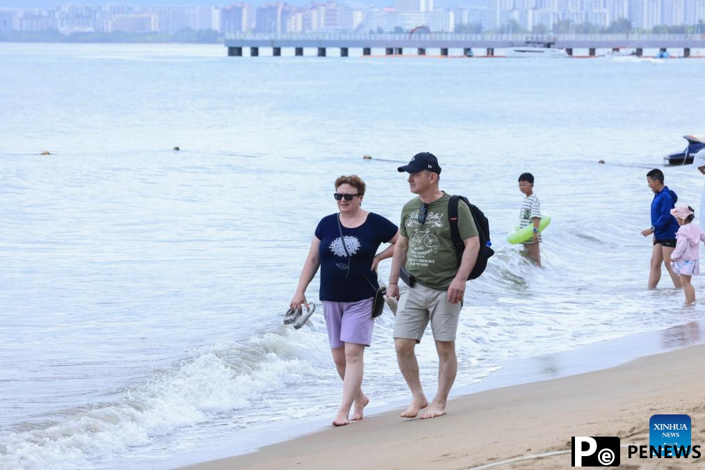 Tourists enjoy themselves in Sanya