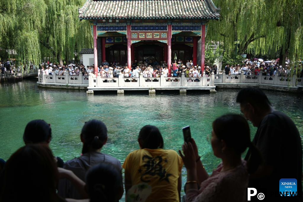 People visit Baotu Spring in Jinan, E China