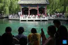 People visit Baotu Spring in Jinan, E China