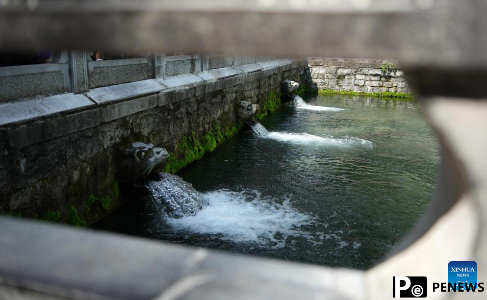 People visit Baotu Spring in Jinan, E China