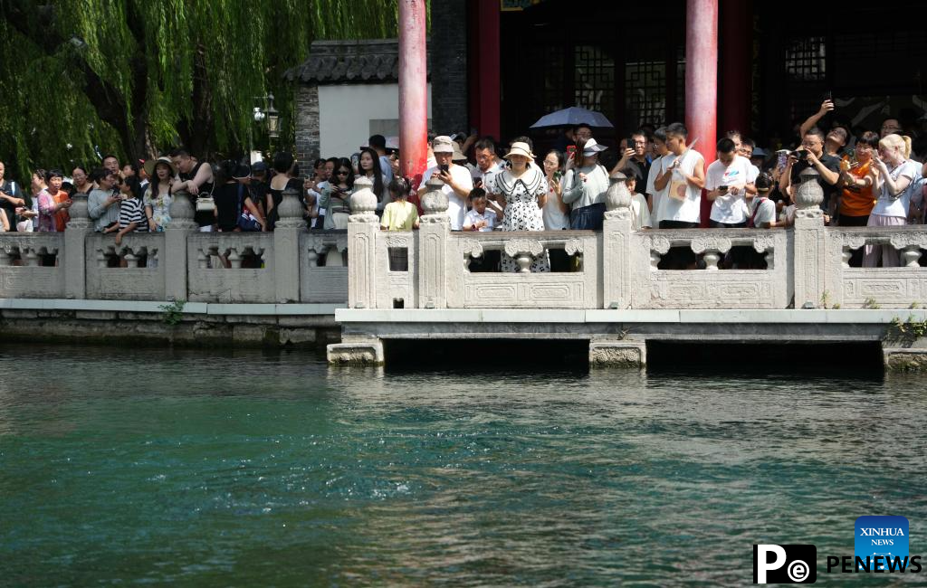 People visit Baotu Spring in Jinan, E China