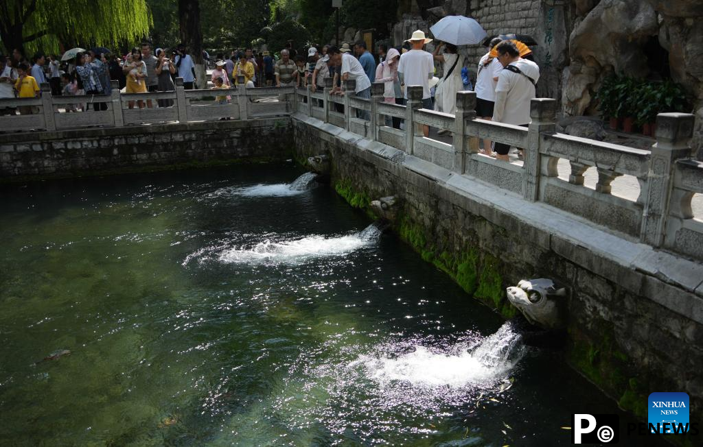 People visit Baotu Spring in Jinan, E China