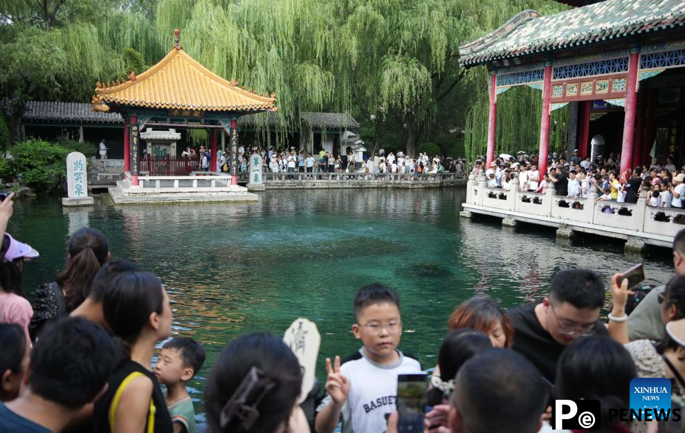 People visit Baotu Spring in Jinan, E China