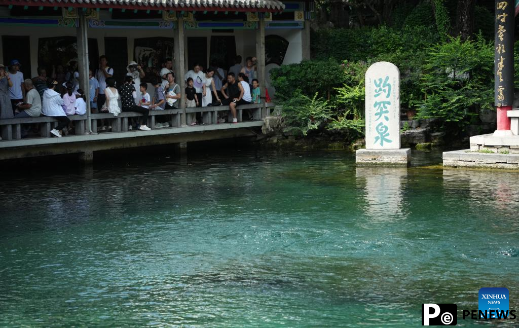 People visit Baotu Spring in Jinan, E China