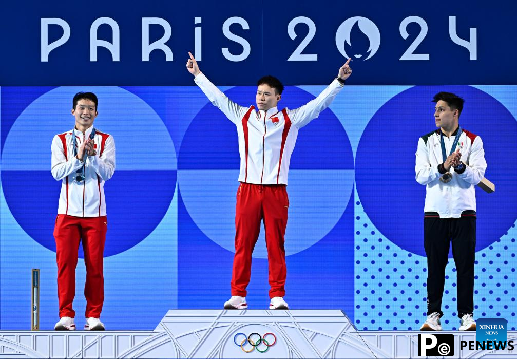 Day 13: Chinese diver defends Olympic title, weightlifting debutant claims gold