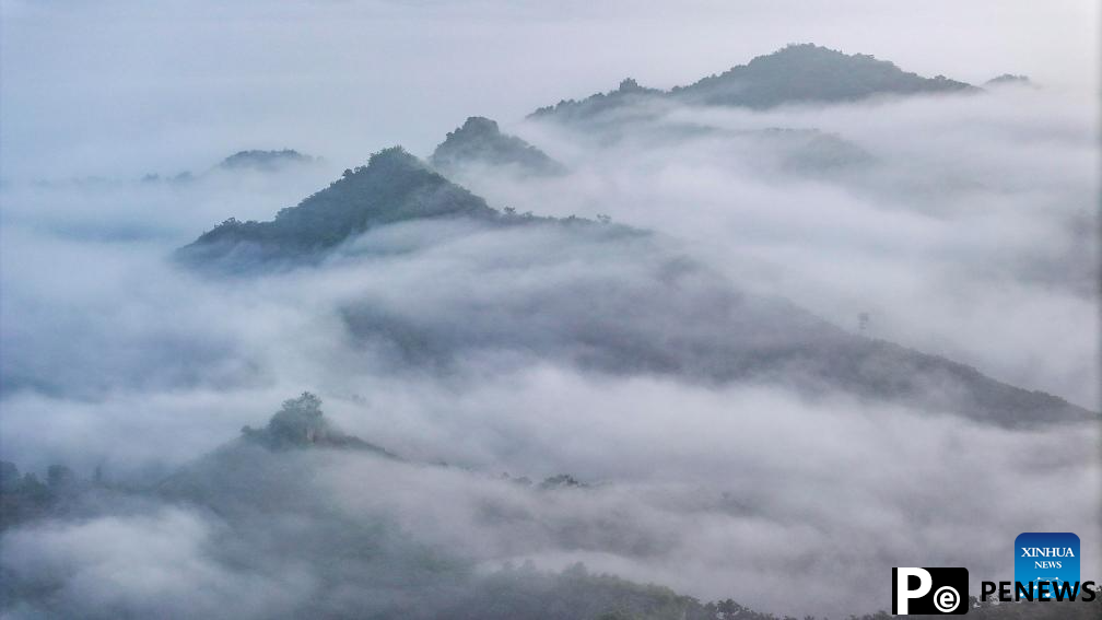 Scenery of Great Wall shrouded in clouds in Hebei