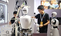 watching display at World Robot Conference in Beijing, showcasing China’s cutting