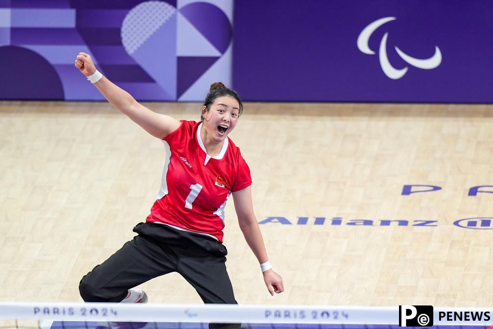 Sitting volleyball guides earthquake survivor Tang onto a different path
