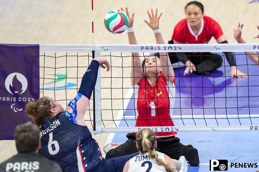 Sitting volleyball guides earthquake survivor Tang onto a different path