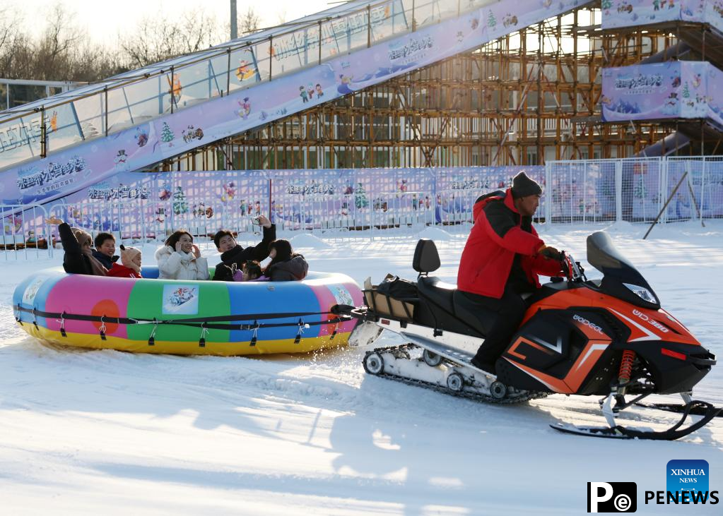 People have fun with ice and snow at National Speed Skating Oval in Beijing