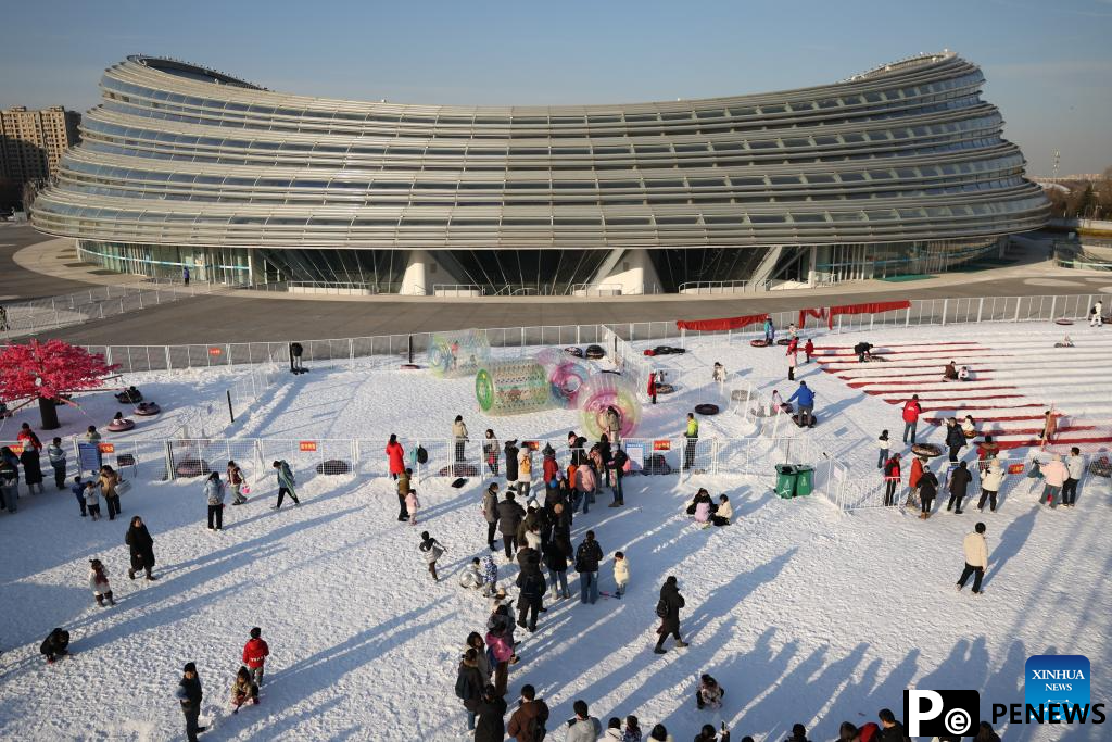 People have fun with ice and snow at National Speed Skating Oval in Beijing