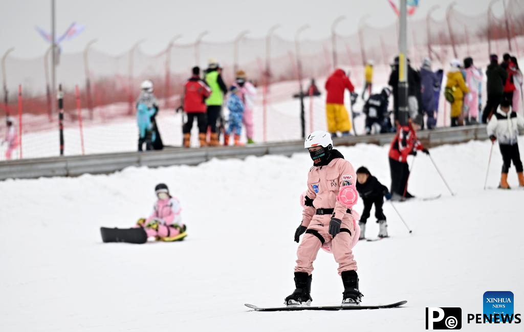 Tourists ski at Yuehai Ski Resort in Yinchuan, China