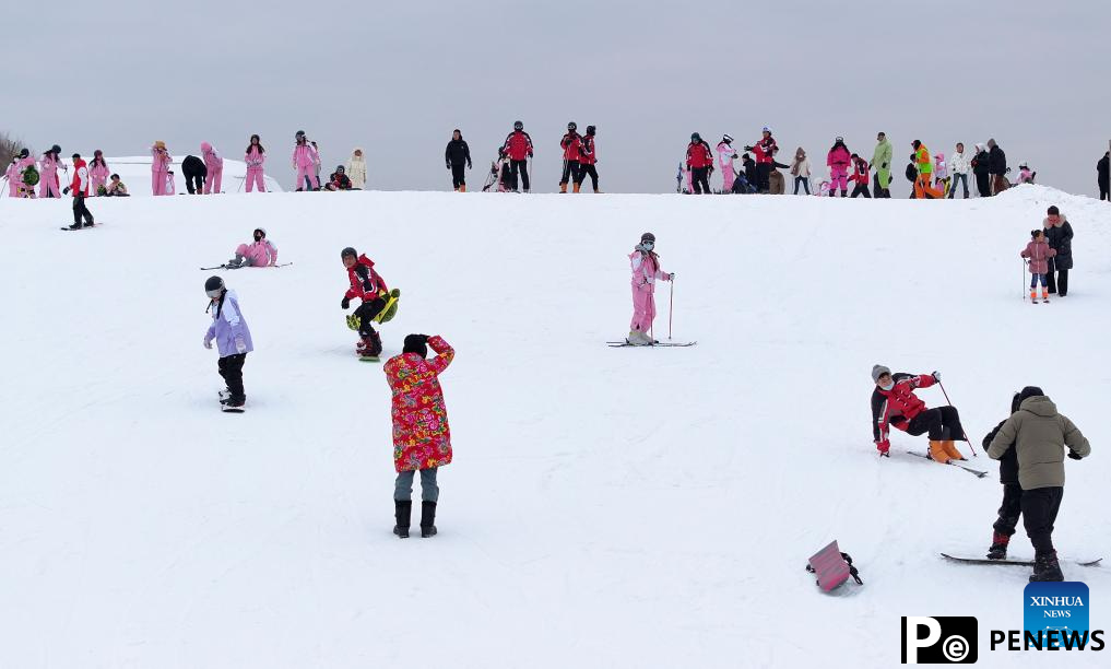 Tourists ski at Yuehai Ski Resort in Yinchuan, China